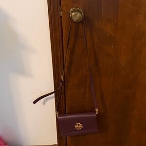 Purple Tory Burch Crossbody Bag with Logo and built in organizer.